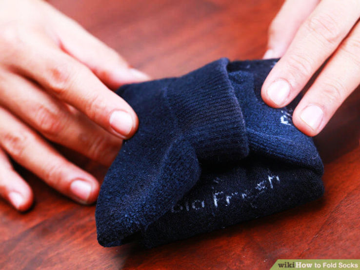 When packing pair of socks in a suitcase, hold each pair together and roll it using the open end of one sock such that the fold takes the other sock inside the first. you will then have only round piece... no chance of losing one